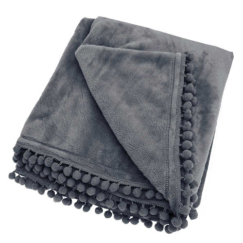 Cashmere feel, super soft charcoal flannel fleece throw from Walton and Co. Finished with a pretty pom-pom braid edge at the shortest ends. 